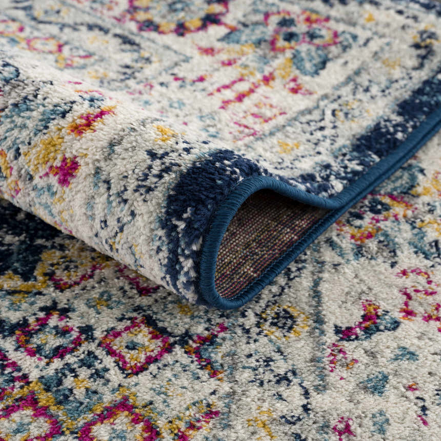 Close-up of the Marash KMRSH-4603 clearance runner rug. Features a navy border and a colorful traditional pattern. Fold