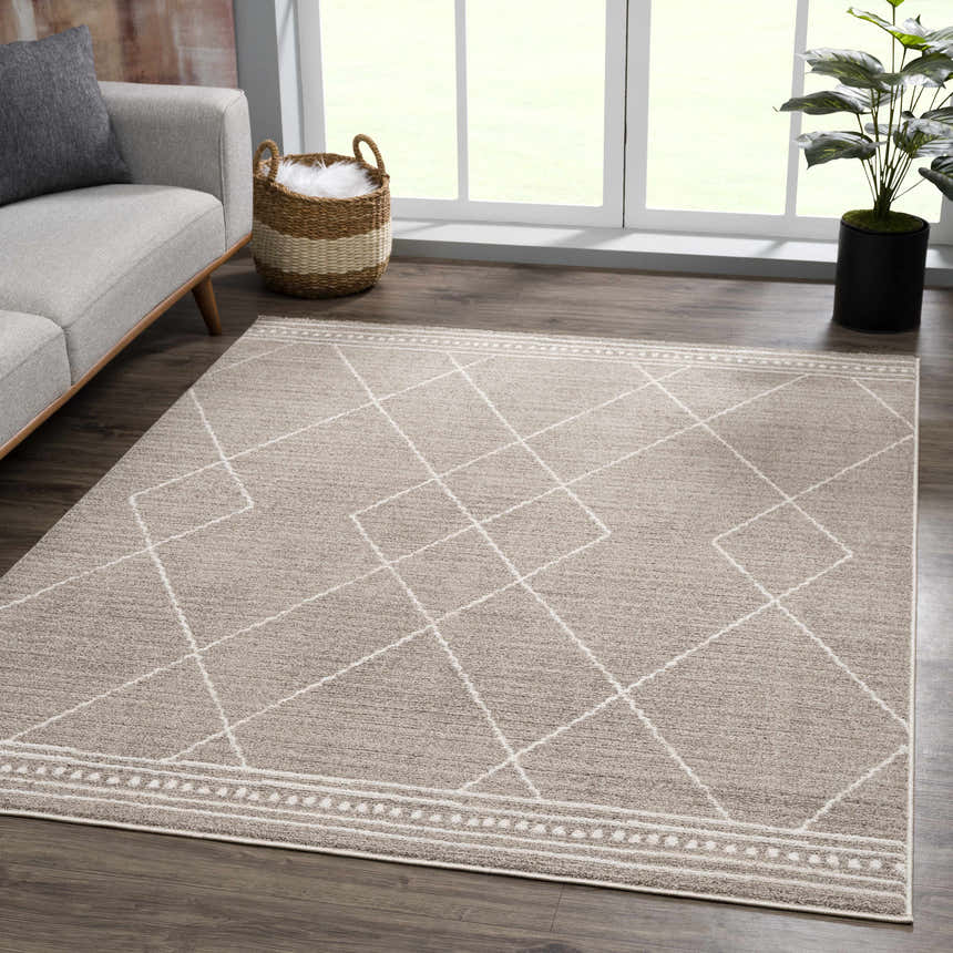 Living room scene with a Kami Area Rug in dark beige and ivory, featuring a Moroccan diamond pattern. Roomscene-Rectangle