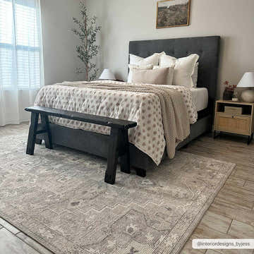 Bedroom scene with gray bed and Elle Medallion Light Gray Area Rug, creating a calming, neutral farmhouse style. Roomscene-Rectangle