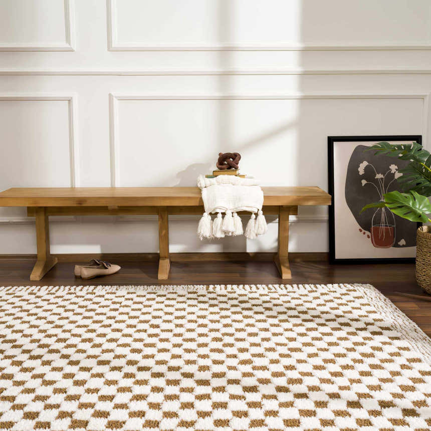 Entryway with a Leryn Brown Checkered Plush Rug, wood bench, art, and neutral decor. Roomscene-Rectangle
