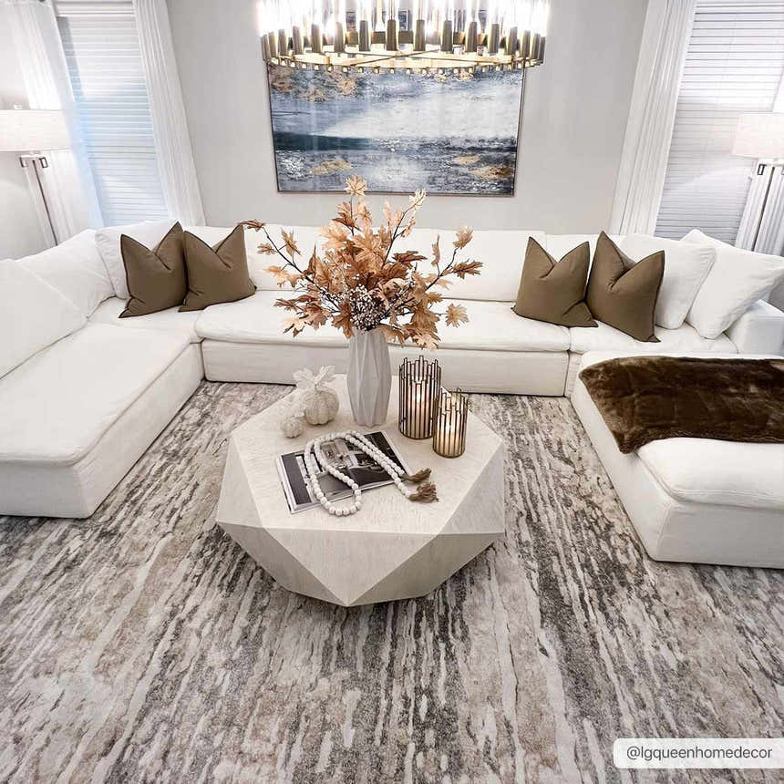 Living room scene with a white sectional sofa and Ferrelview Area Rug in gray and ivory. Roomscene-Rectangle