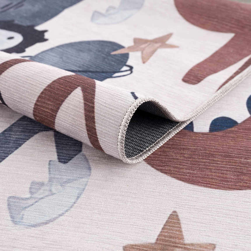 Close-up of Libra Rainbow Kids Washable Area Rug showing beige base with dark red, terracotta, and blue shapes. Fold