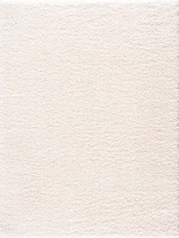 Close-up of the plush texture of the Faina Solid Cream Shag Washable Area Rug. Design-Rectangle-5373
