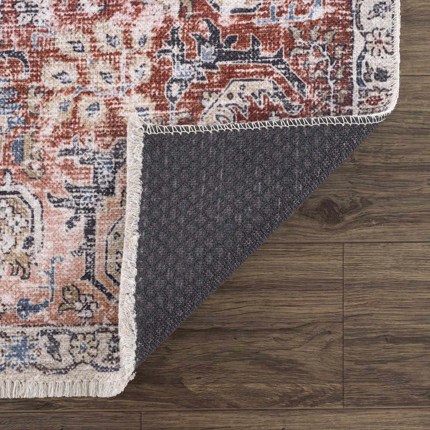 Close-up of the Burgundy Holi-2303 Washable Area Rug showing its vintage design, burgundy, cream, and blue colors, and fringed edge. Fold