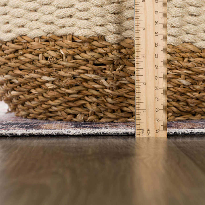 Close-up of the Holi-2305 Boutique Washable Rug showing the rug's thickness with a ruler and basket. Pile