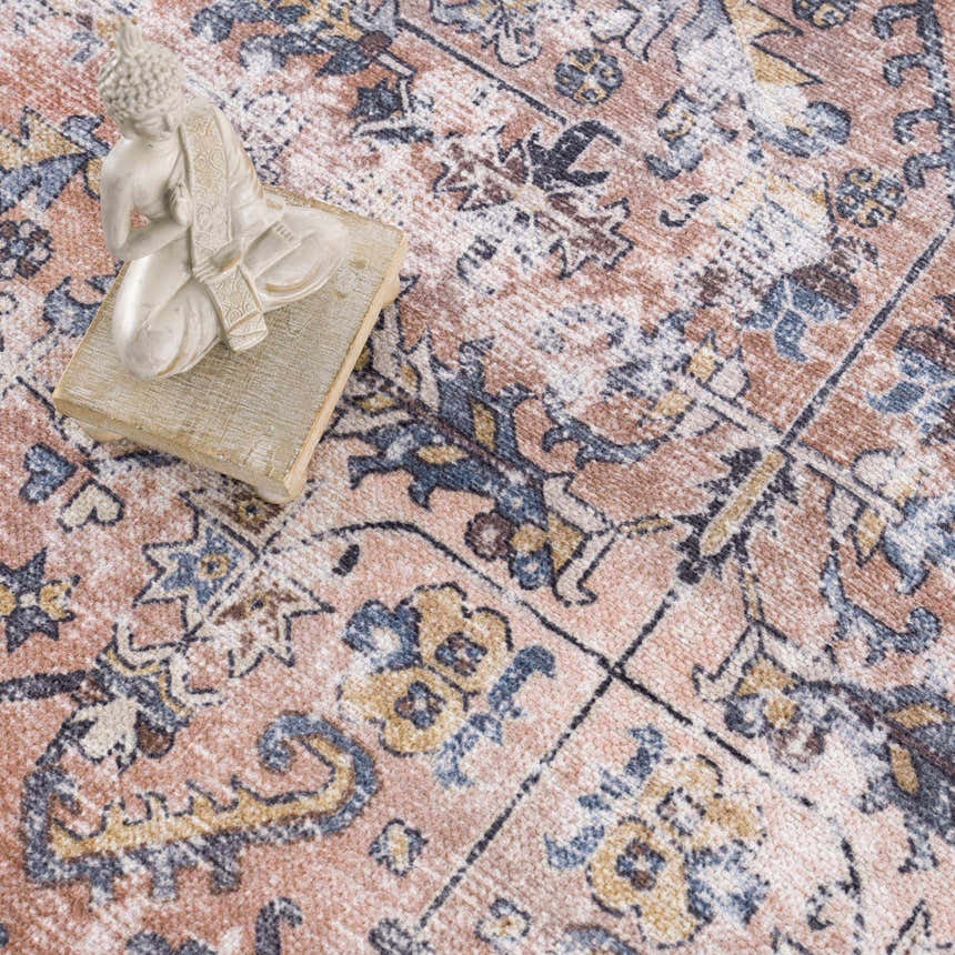 Close-up of the Holi-2305 Boutique Washable Rug. Features a traditional, vintage pattern in burgundy, cream, slate, and yellow. Styleshot