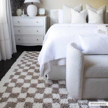 Bedroom scene with white bedding and the Kieu Taupe Checkered Shag Rug, which adds a cozy, geometric touch. Roomscene-Rectangle