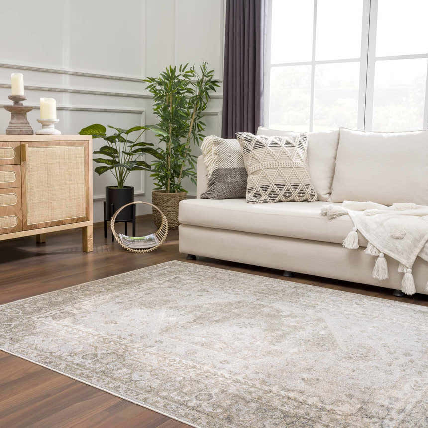 Living room with a light sofa and a tan and olive Gael Boutique Washable Rug. Roomscene-Rectangle