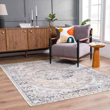 Living room with gray walls, wood furniture, and a Rudo Flat Pile Washable Rug in gray, blue, and beige. Roomscene-Rectangle