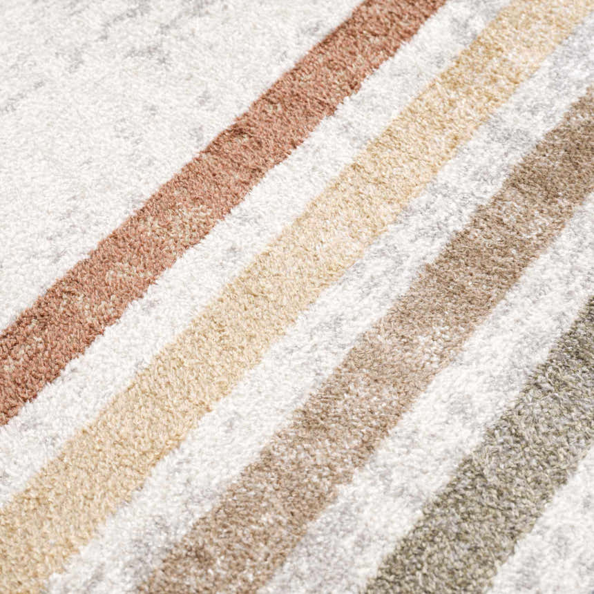Close-up of the Giza Washable Area Rug showing the striped pattern and soft texture in tan, rust, and off-white hues. Texture