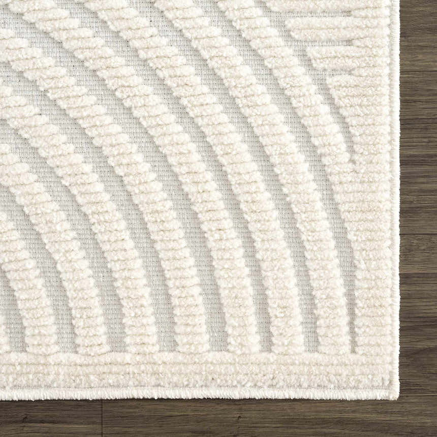 Close-up of the Deron White Washable 3D Rug. Features a geometric, curved pattern and plush texture in off-white tones. Swatch