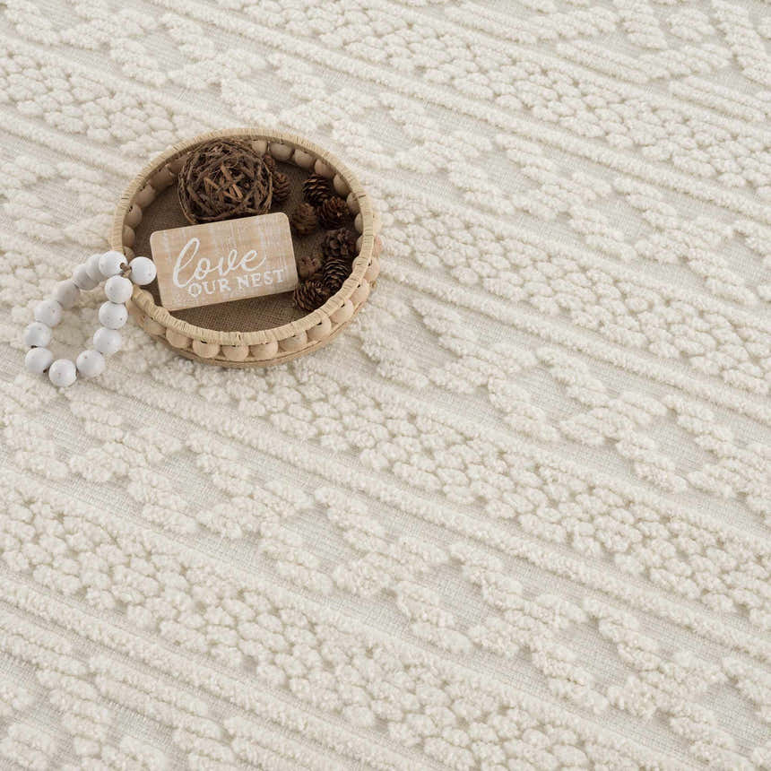 Close-up of the Fadey White 3D Washable Rug showing its geometric pattern and soft, textured design. Styleshot