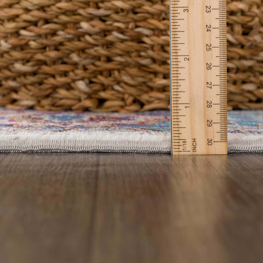 Close-up of Mardin Colorful Area Rug showing rug pile height with ruler. Bohemian style rug texture. Pile