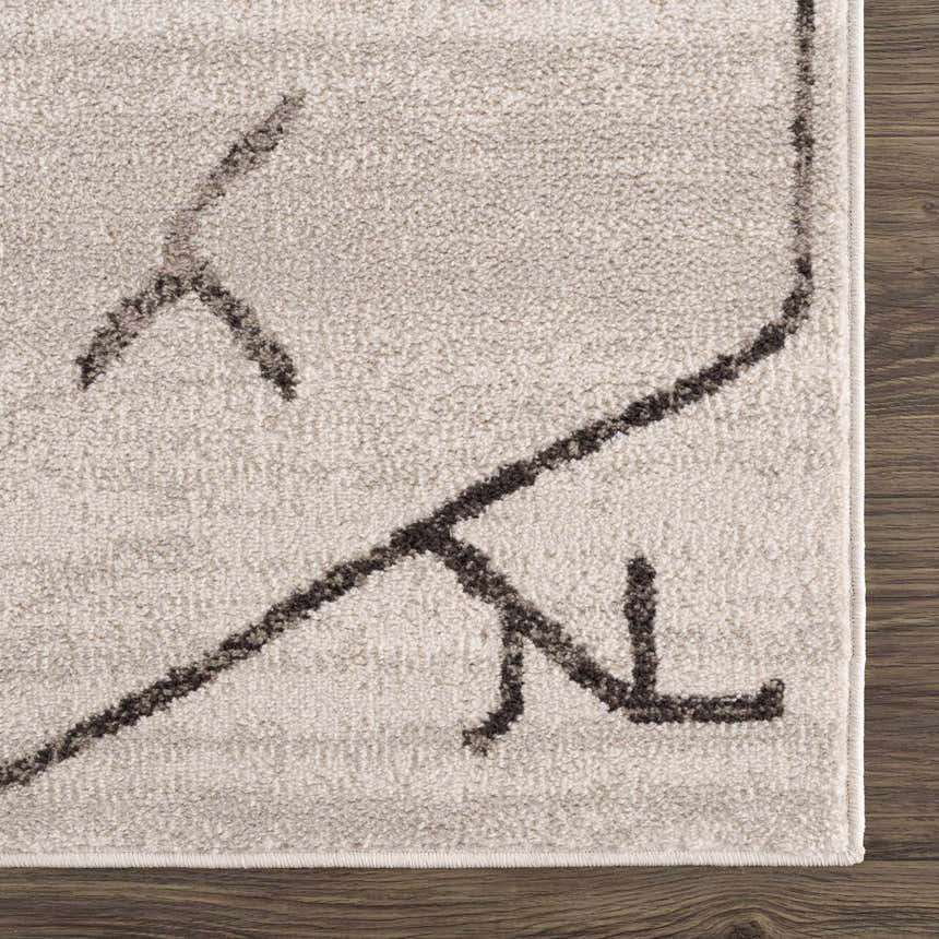 Close-up of Azzan Cream & Charcoal Area Rug showing the cream base and charcoal Southwestern-style geometric pattern. Swatch