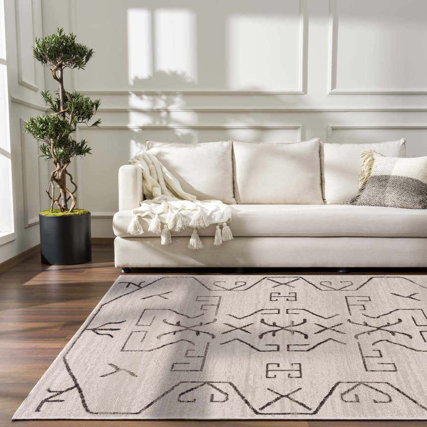 Living room scene with cream sofa and Azzan Cream & Charcoal Area Rug, featuring Southwestern design. Roomscene-Rectangle