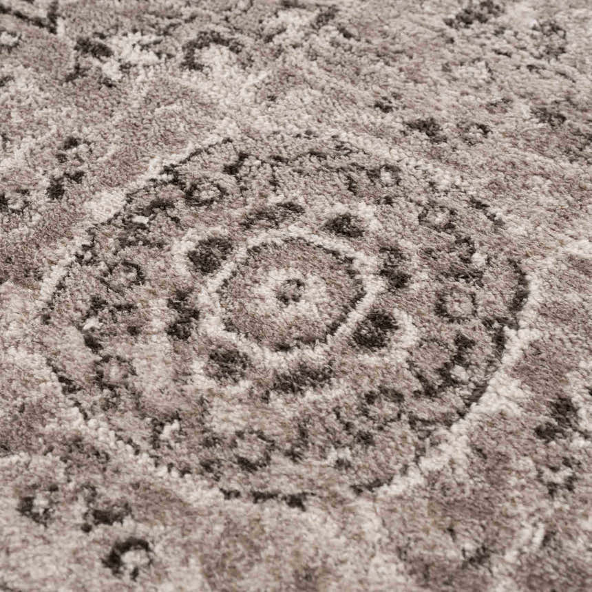 Close-up of the Albie Charcoal & Beige Area Rug showing its traditional medallion pattern and soft, textured pile. Texture