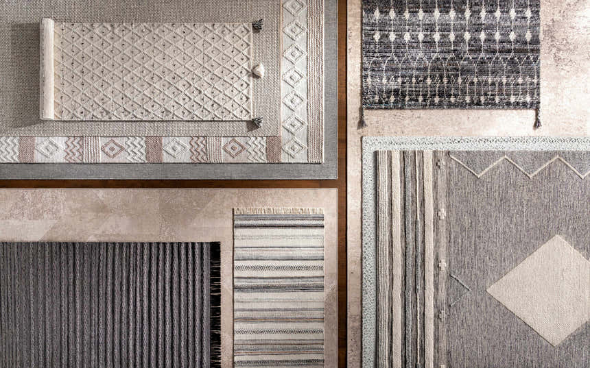 Close-up of various gray Junortoun Area Rugs. Hand woven, contemporary style with geometric patterns and textures. Styleshot
