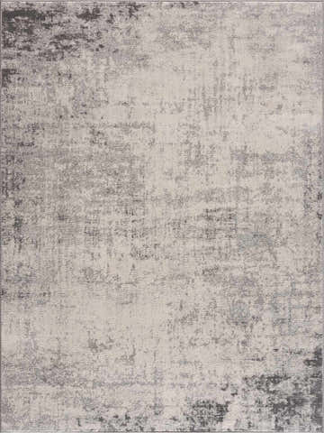 Close-up of the Kalanganan Abstract Gray Rug, featuring a distressed charcoal, gray, and off-white pattern. Design-Rectangle-5371