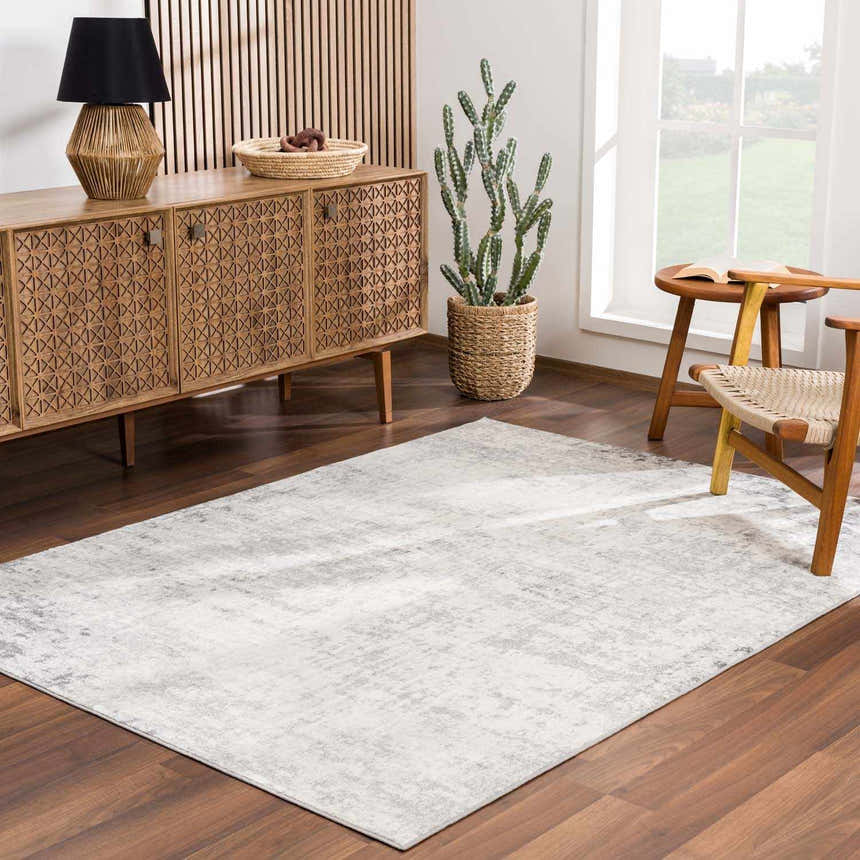 Living room scene with a Kalanganan Abstract Gray Rug, wood floors, and a mid-century modern console table. Roomscene-Rectangle