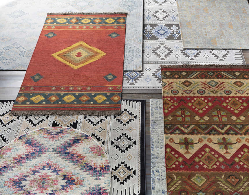 Overhead shot of multiple Grimsby Wool Area Rugs in bohemian, southwestern, and contemporary styles. Styleshot