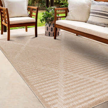 Outdoor patio scene with wood furniture and Anah Tan Outdoor Rug featuring a contemporary geometric design. Roomscene-Rectangle