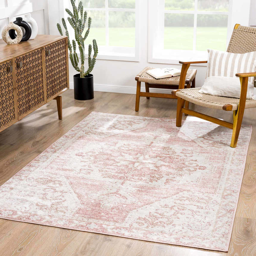 Living room with a Snead Pink Floral Rug, woven chairs, and a wood cabinet. Roomscene-Rectangle