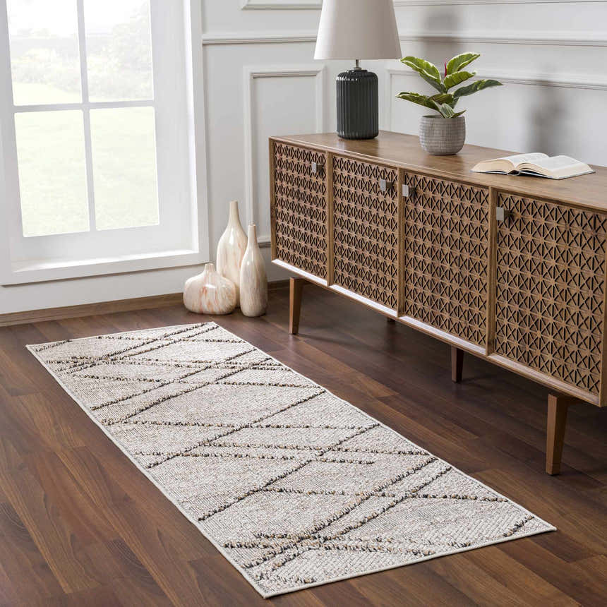 Entryway scene with Baqer Bone & Tan rug runner on wood floor, near a console table with vases and a lamp. Roomscene-Runner