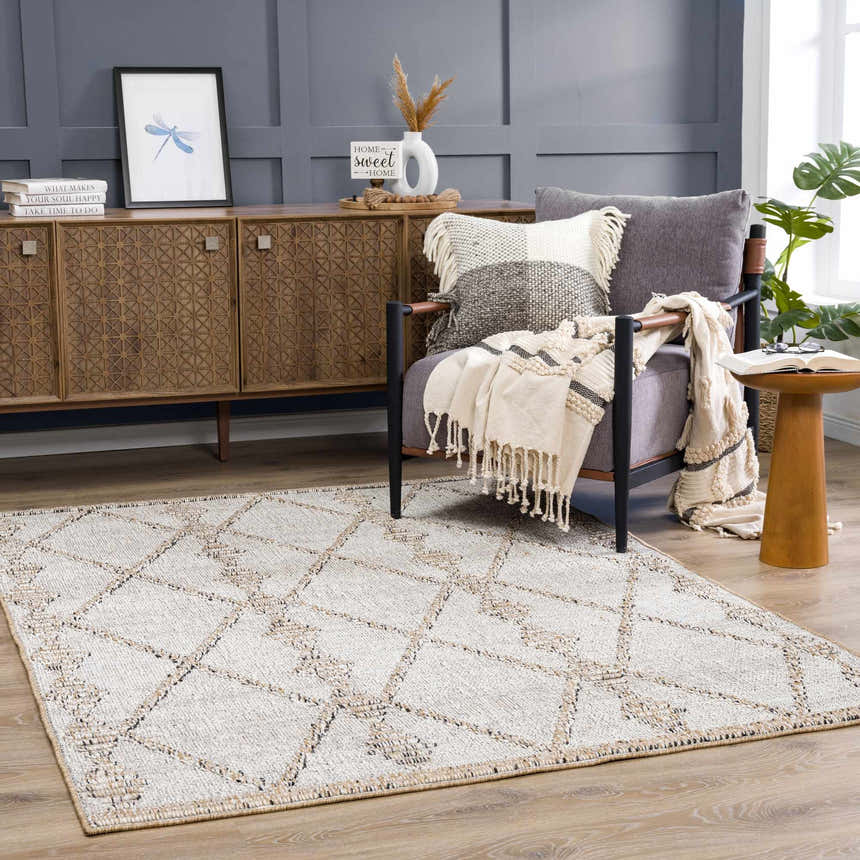 Farmhouse living room with Nyla Bone & Tan Textured Performance Rug, wood cabinet, gray chair, and neutral accents. Roomscene-Rectangle