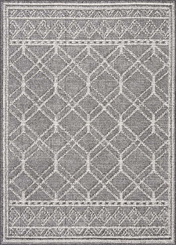 Close-up of the Diah Black & Bone Area Rug, featuring a geometric diamond pattern and decorative borders. Design-Rectangle-46