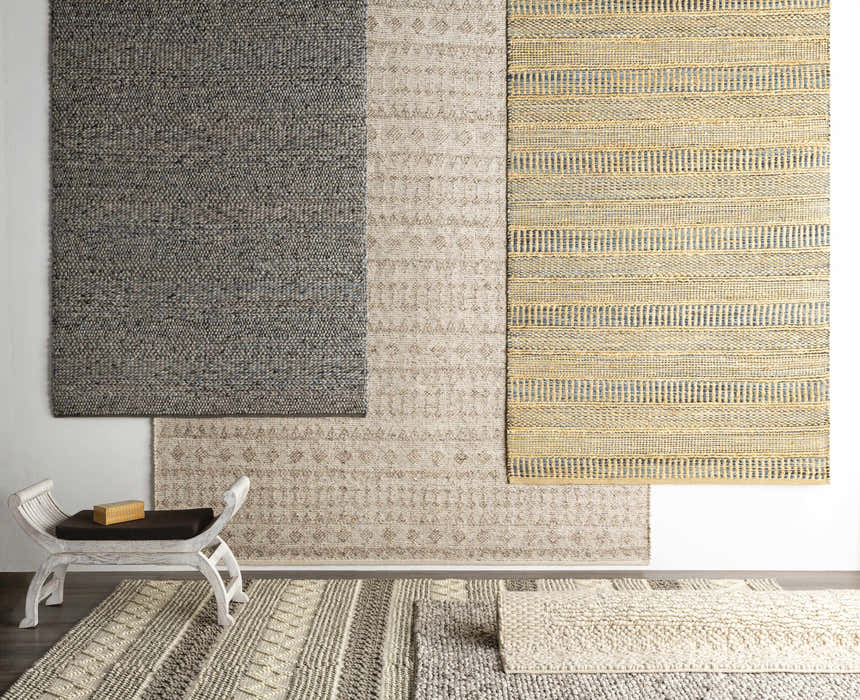 Bohemian rug display: Whittington Gray&Cream Wool Rug with geometric patterns, hand woven texture, and neutral color palette. Styleshot