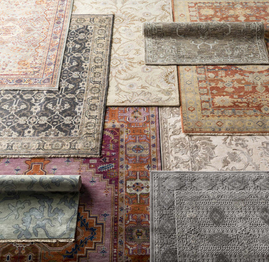 Overhead shot of various Brookeland Area Rugs in beige, red, blue, sage, slate, and tan colors. Hand-knotted wool rugs. Styleshot