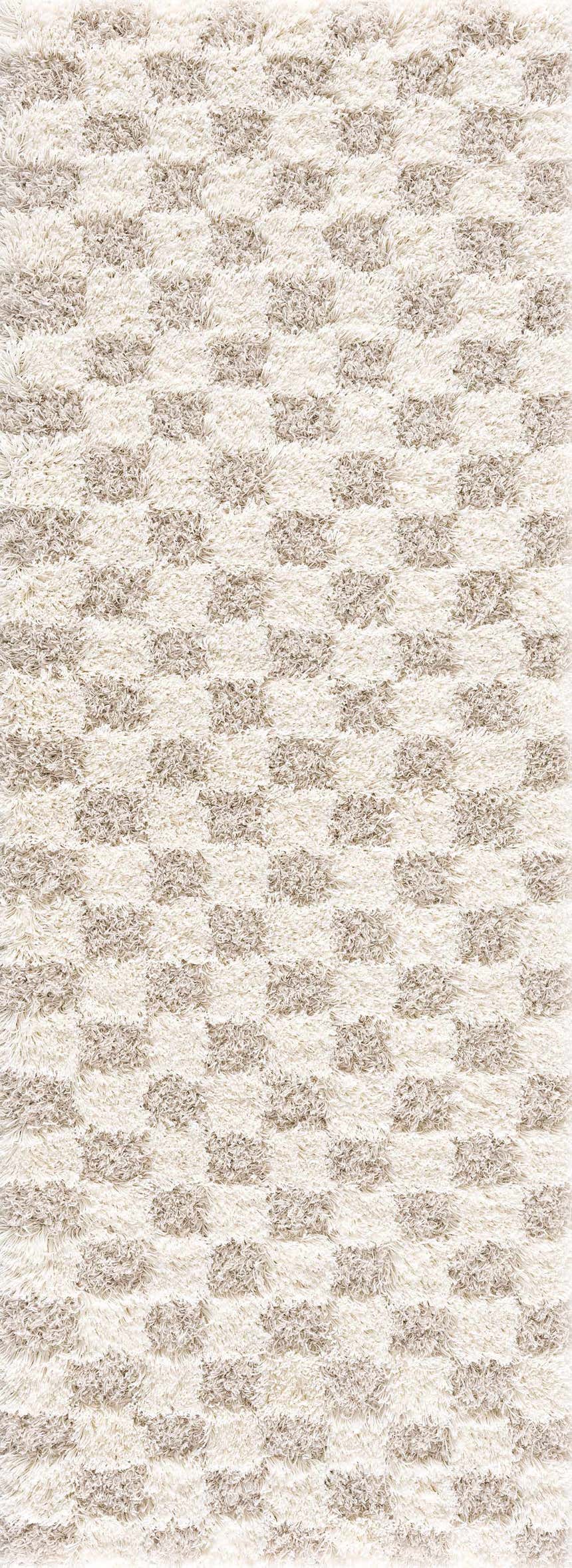Close-up of the Atira Light Brown Checkered Area Rug. Cream and light brown shag rug with a geometric checkered pattern. Design-Runner-2773
