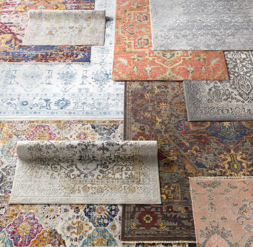 Close-up of multiple rug patterns and textures, including the Watford Updated Traditional Tibetan Rug. Styleshot