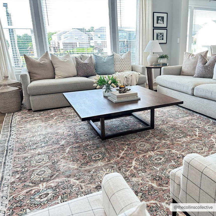 Living room scene with a Flat Pile Urpi Red Washable Rug, gray sofas, and a dark wood coffee table. Roomscene-Rectangle