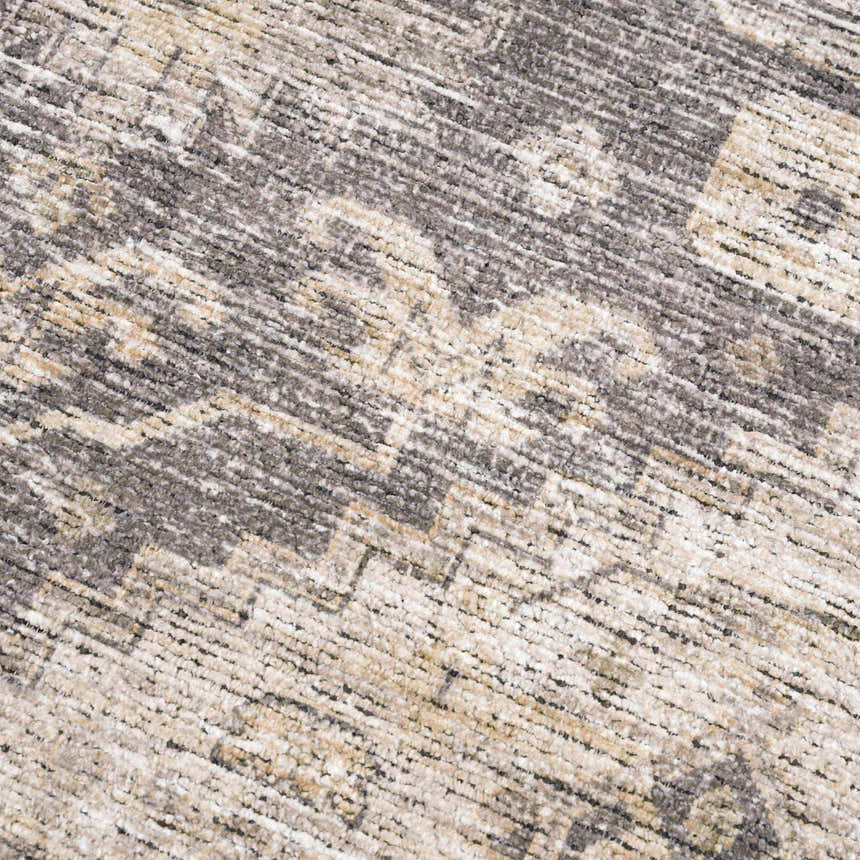 Close-up of the Keola Washable Area Rug, showing the chenille texture and farmhouse-style gray and beige pattern. Texture