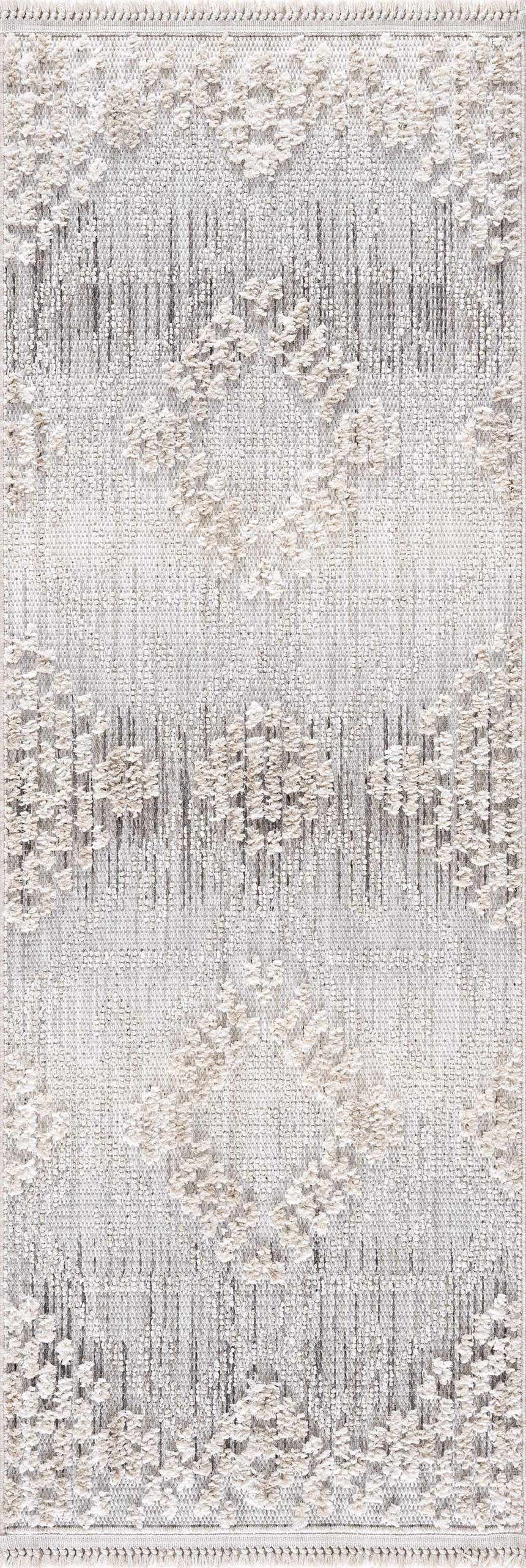 Close-up of the Poydras High-Low Rustic Rug. Charcoal, gray, and light beige rug with a textured diamond pattern. Design-Runner-2773