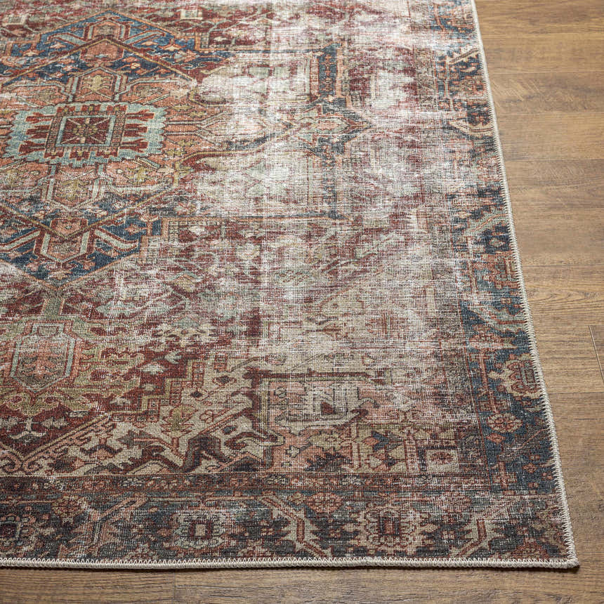 Close-up of the Adtugan Vintage Flat Pile Washable Rug. Burgundy, navy, rust, and green oriental pattern on a wood floor. Front
