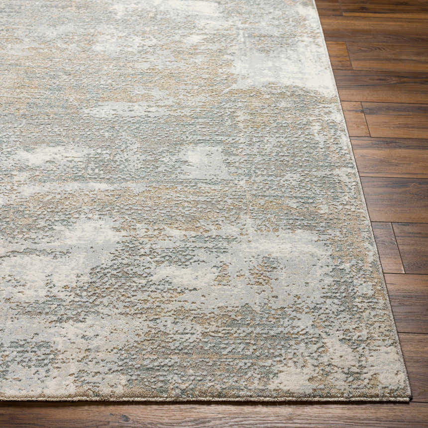 Close-up of the Adwoa Boutique Rug showing its abstract gray, nutmeg, and cloud gray pattern and soft texture. Front