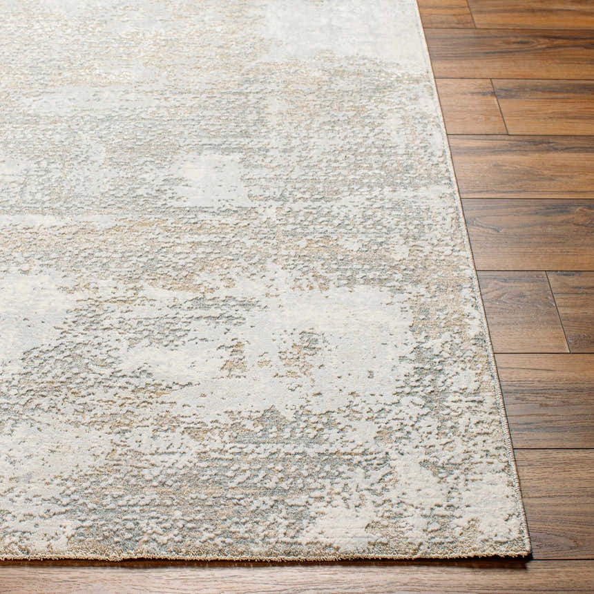 Close-up of Adwoa Boutique Rug showing a contemporary abstract pattern in cloud gray, dark gray, and nutmeg on wood floors. Front