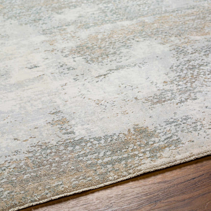 Close-up of the textured Adwoa Boutique Rug. Features cloud gray, nutmeg, and light gray hues with a contemporary design. Texture