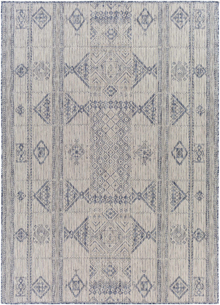 Close-up of the Malamig Gray & Blue Area Rug. Geometric diamond pattern in shades of blue, gray, and off-white. Machine woven texture. Design-Rectangle-537
