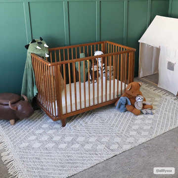Kids room with a crib and Dama Wool Rug with Tassels in bone and gray, creating a cozy, neutral, farmhouse style. Roomscene-Rectangle