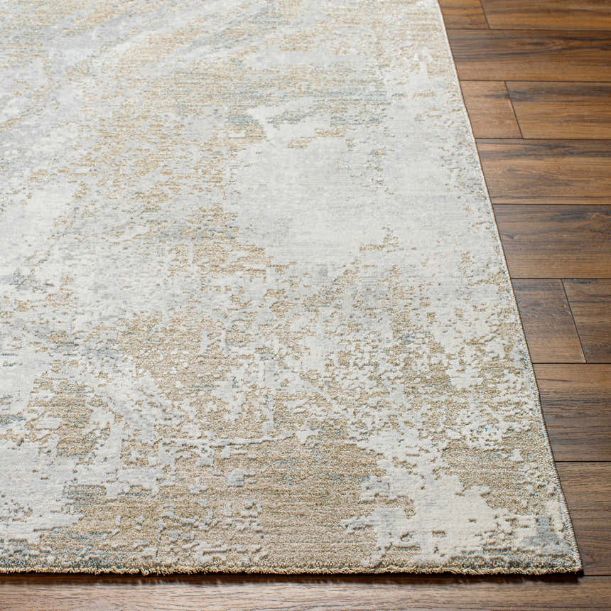 Close-up of the Ambra Thick Luxe Boutique Rug showing its gray, light brown, and white contemporary pattern. Front