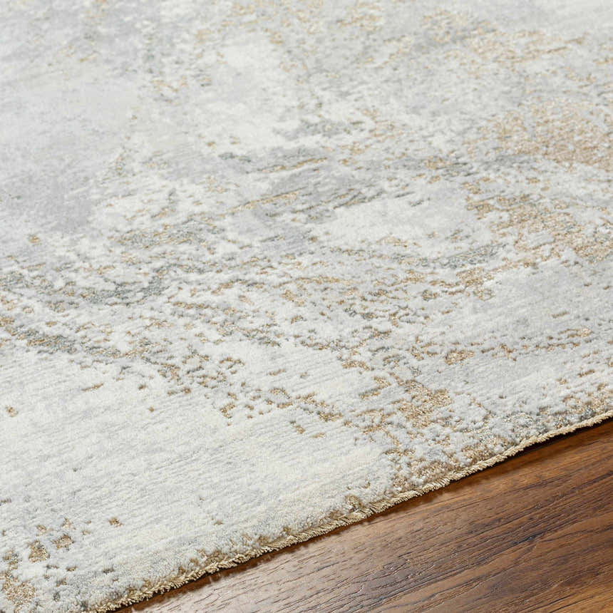 Close-up of the Ambra Thick Luxe Boutique Rug showing a cloud gray, dark brown, and gray abstract pattern. Texture
