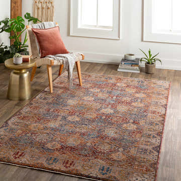 Living room scene with the Anambongan Area Carpet, chair, side table, and plants for a cozy, traditional style. Roomscene-Rectangle