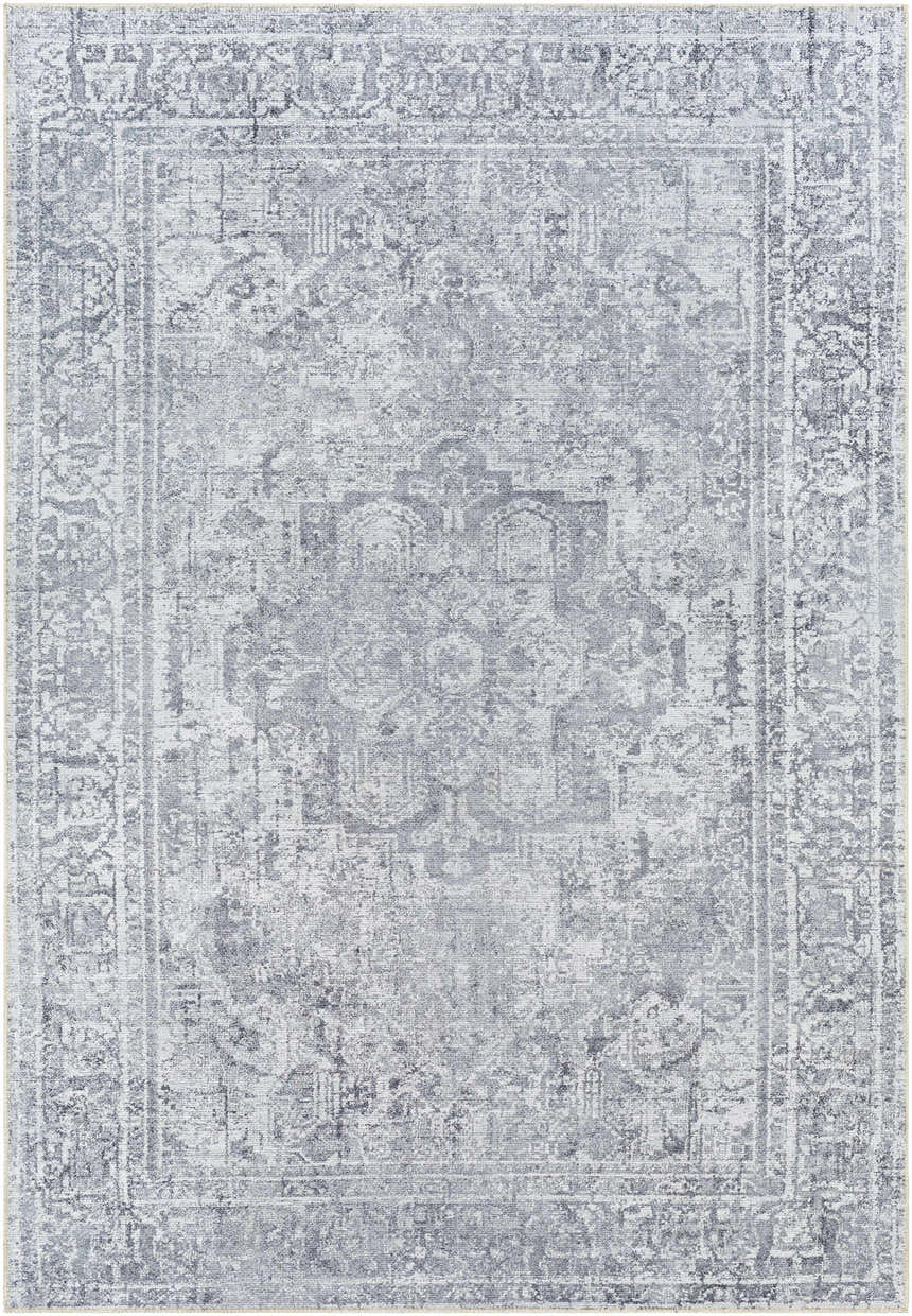 Close-up of the Aquino Washable Area Rug in charcoal, gray, and light gray with a traditional oriental pattern. Design-Rectangle-5373