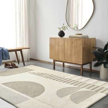 Modern entryway with a Brooklyn Beige Modern Wool Rug, wood cabinet, bench, and oval mirror. Neutral color palette. Roomscene-Rectangle