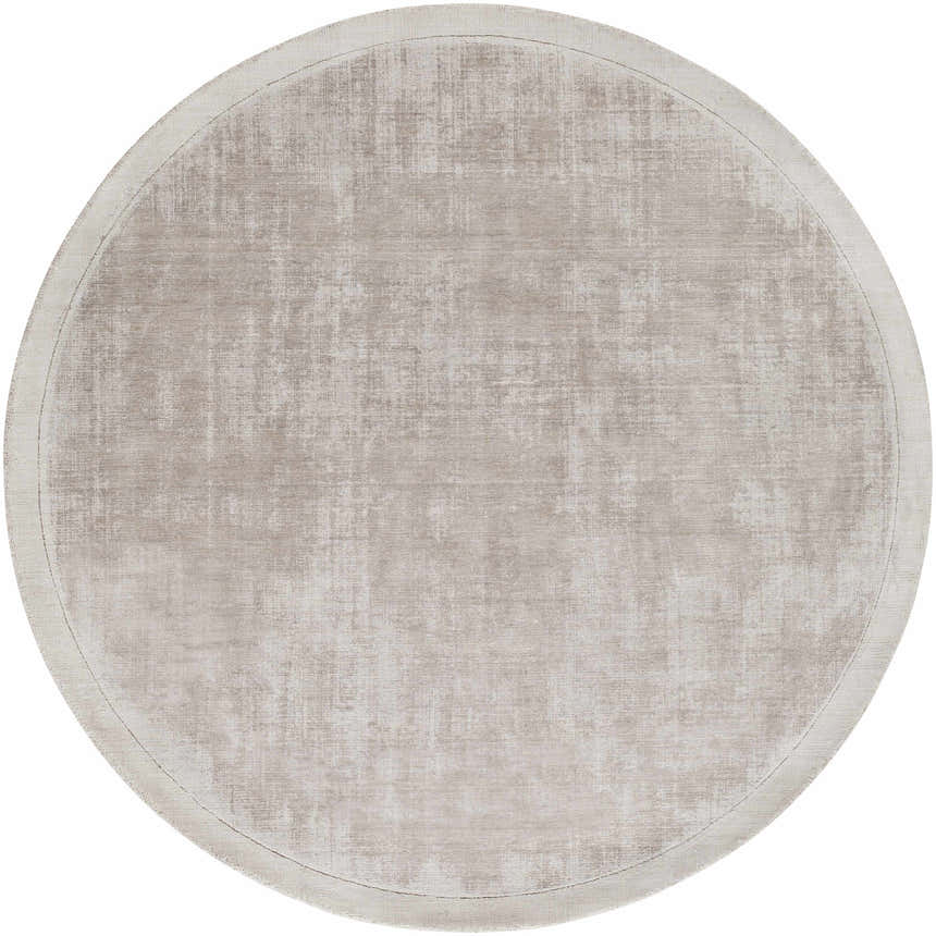 Close-up of round Auchter Soli Taupe rug. Premium sheer carpet with subtle texture and medium gray tones. Design-Round-59