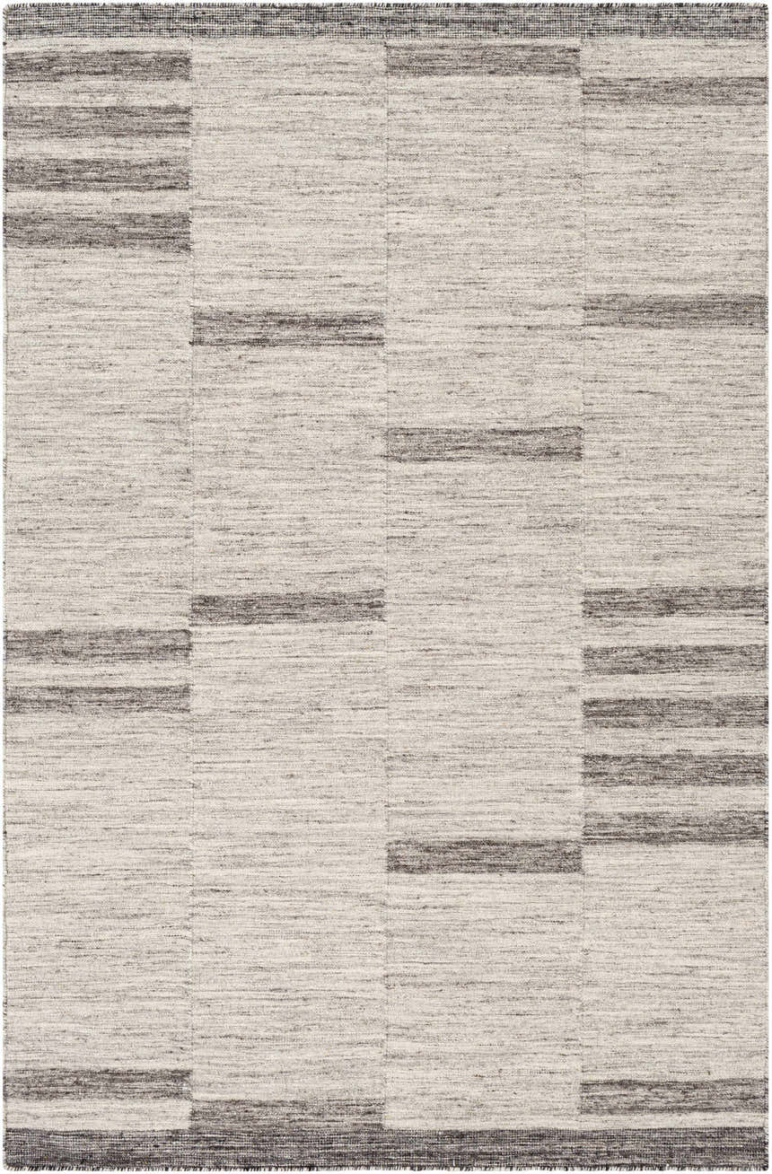 Close-up of the Auchinleck Area Rug. Hand-woven wool and viscose rug with a charcoal and cream geometric pattern. Design-Rectangle-576