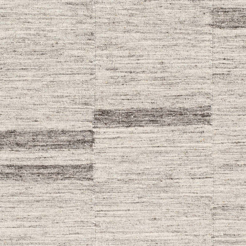 Close-up of the hand woven Auchinleck Area Rug. Charcoal and cream wool and viscose blend with a subtle horizontal pattern. Swatch